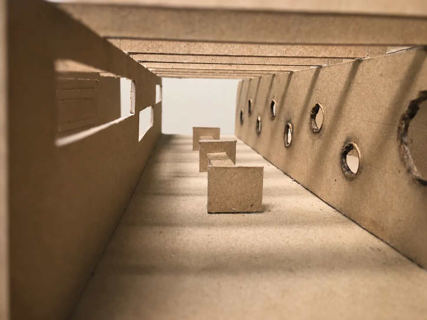 Interior of the physical model looking down the path with framed apertures